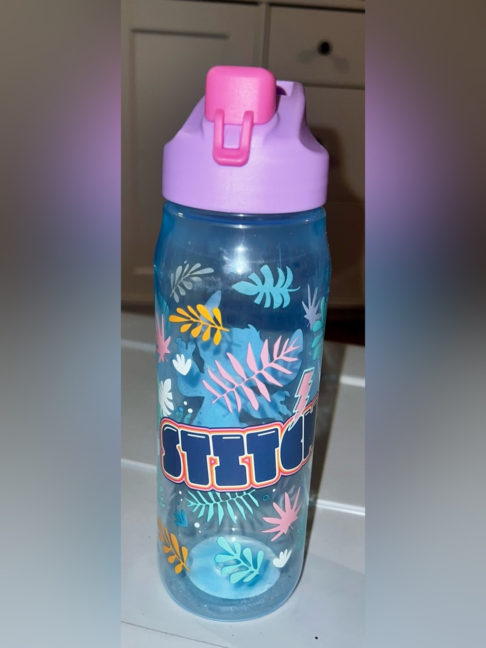 Disney Stitch plastic travel water bottle featuring a purple flip-top lid NEW